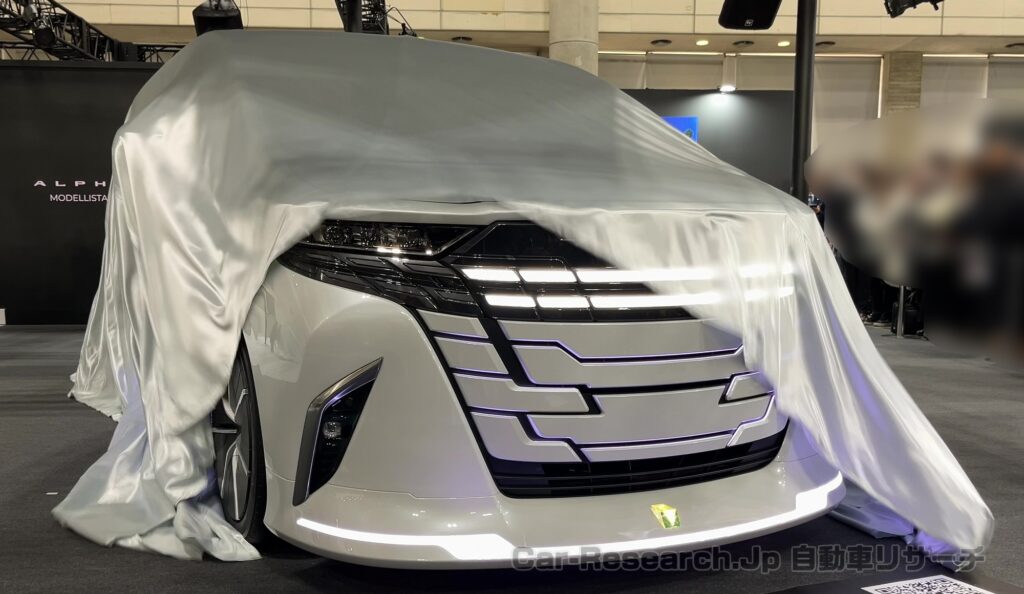 新型【アルファード】モデリスタ コンセプトで新デザイン提案、東京オートサロン画像、2026年夏に田原工場で増産計画、ヴェルファイアはプレミアムイメージ継続【トヨタ最新情報】マイナーチェンジいつ？ハンマーヘッド採用のフェイスリフトある？新型エルグランド プロパイロット2.0対抗の先進運転支援の期待